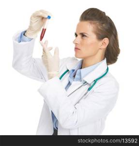 Doctor woman checking test tube