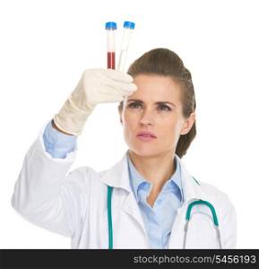 Doctor woman checking test tubes