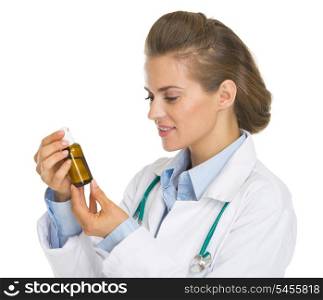 Doctor woman looking on medicine bottle
