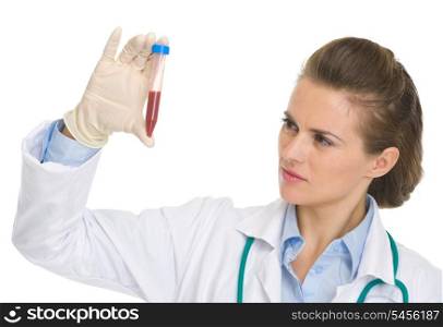 Doctor woman looking on test tube