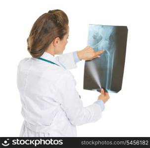 Doctor woman pointing on fluorography . rear view