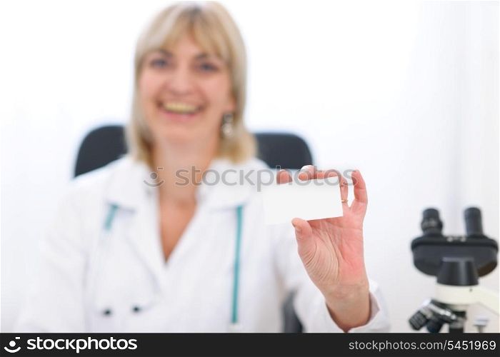 Doctor woman showing business card