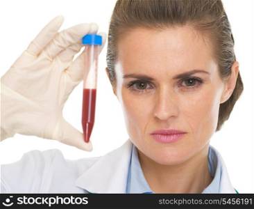 Doctor woman showing test tube