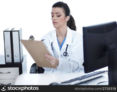 Doctor woman sitting on her office making notes on white background