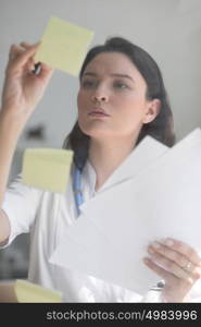 Doctor working at office with patient symptoms and test results