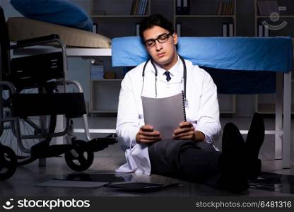 Doctor working night shift in hospital after long hours