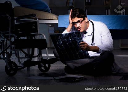 Doctor working night shift in hospital after long hours