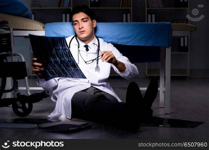 Doctor working night shift in hospital after long hours