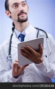 Doctor working on the tablet