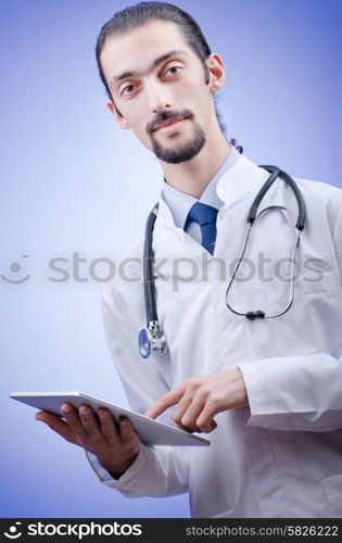 Doctor working on the tablet