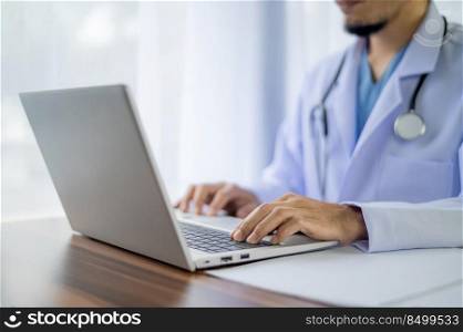 Doctor working with computer notebook in hospital office, Healthy medical concept