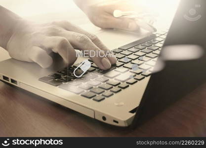 Doctor working with digital tablet and laptop computer in medical workspace office and medical network media diagram as concept