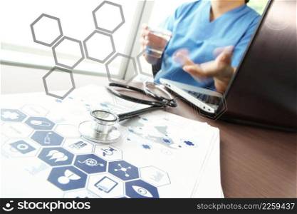 Doctor working with  laptop computer in medical workspace office and medical network media diagram as concept