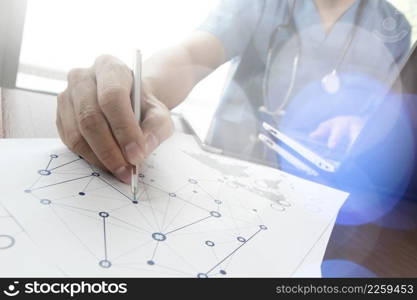 Doctor working with laptop computer in medical workspace office and medical network media diagram as concept