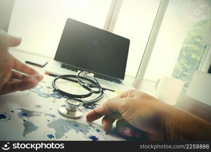 Doctor working with laptop computer in medical workspace office and medical network media diagram as concept