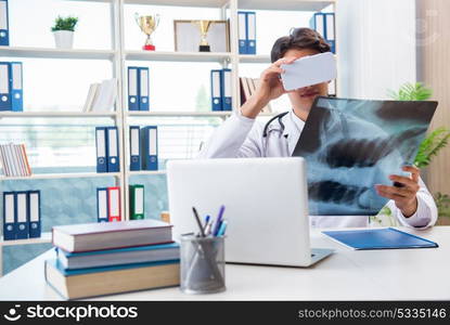 Doctor working with virtual VR reality glasses