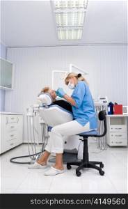 doctor works with patient in the dentist office. dentist office