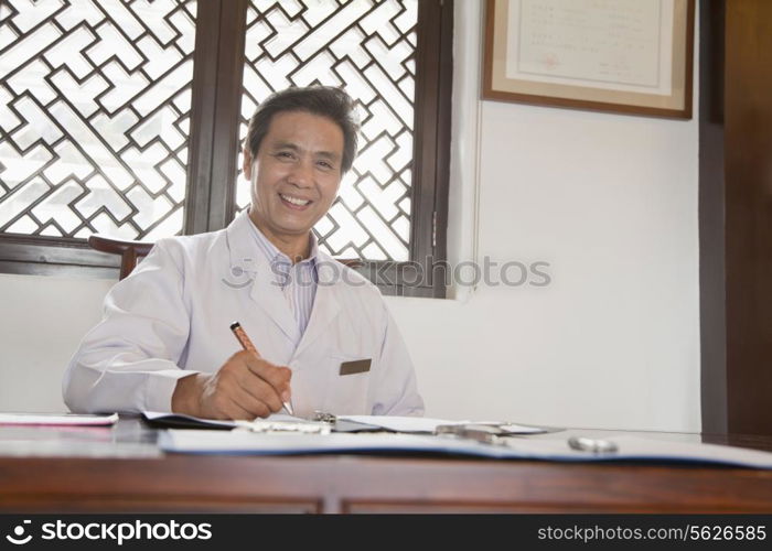 Doctor Writing at His Desk