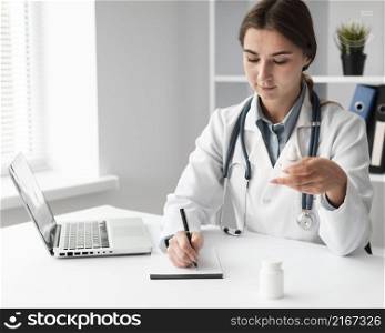 doctor writing medical prescription