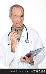 Doctor writing on a clipboard