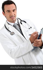 Doctor writing on clipboard smiling