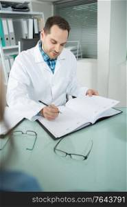 doctor writing on schedule
