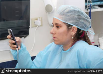 doctor writting on her cellphone