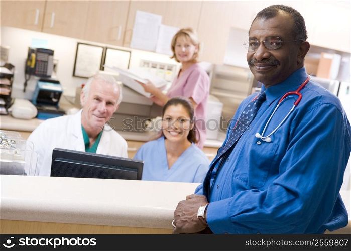 Doctors And Nurses At The Reception Area Of A Hospital