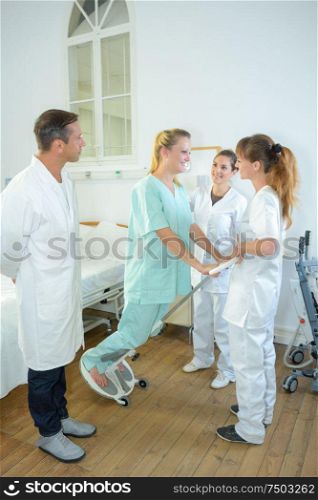 doctors during physical therapy session