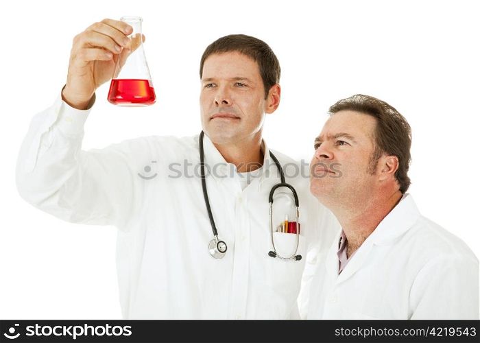 Doctors examine the results of a medical test in a flask. Isolated on white.