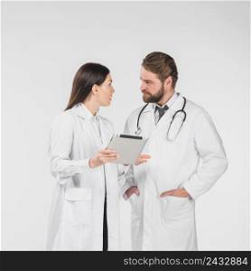 doctors female male discussing looking each other