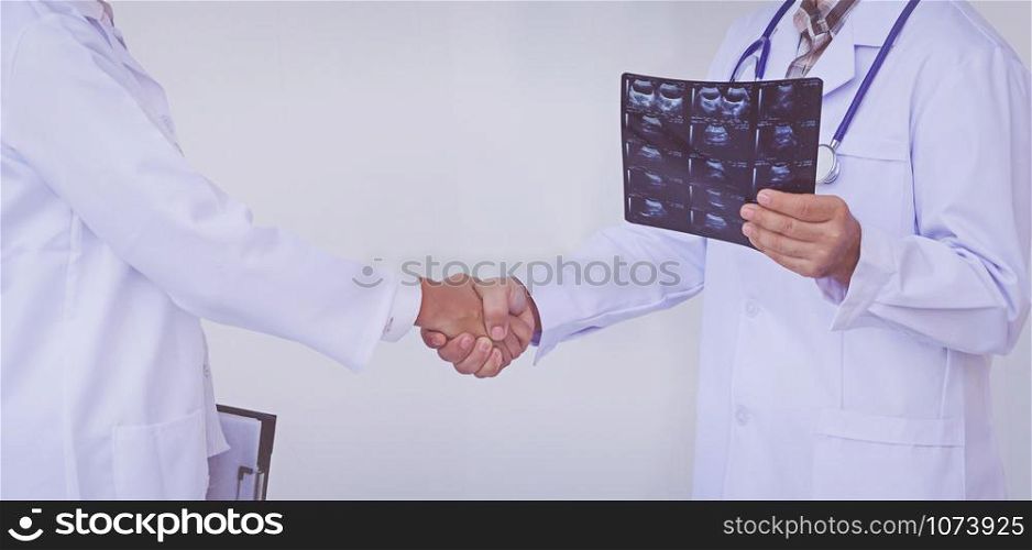 Doctors holding a clipboard with prescription, concept teamwork