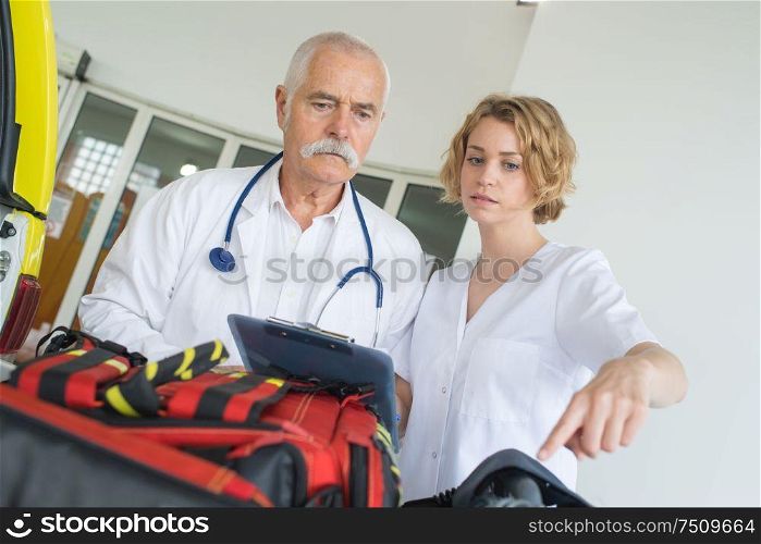 doctors in hospital with ambulance