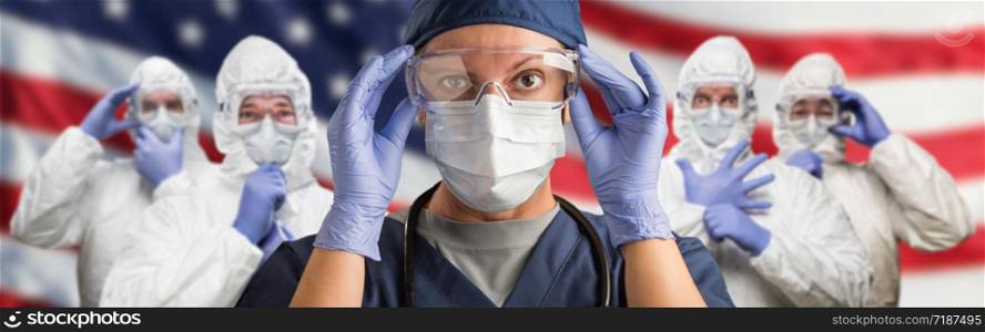 Doctors or Nurses Wearing Medical Personal Protective Equipment (PPE) Against The American Flag Banner.