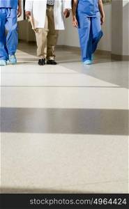 Doctors walking down corridor