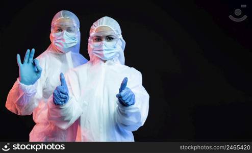 doctors wearing protective medical equipment with copy space 2