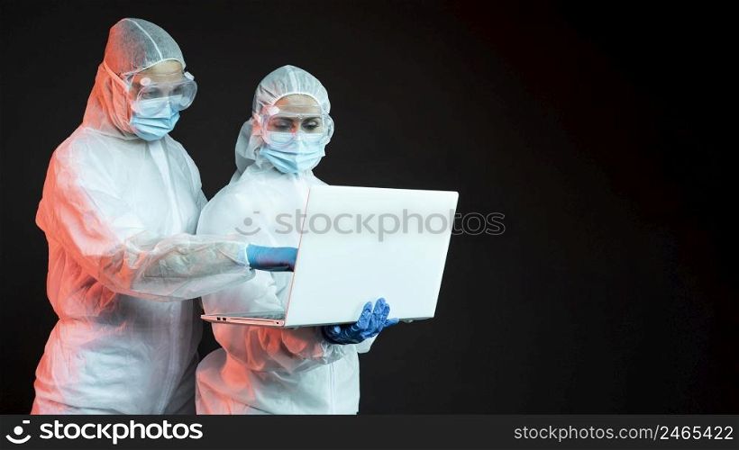 doctors wearing protective medical equipment with copy space