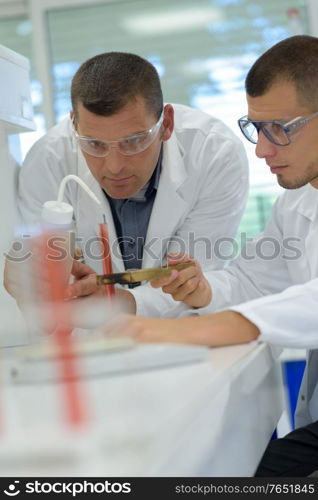 doctors working with blood tests