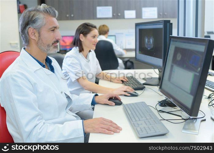 doctors working with laptop computer