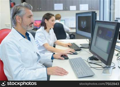 doctors working with laptop computer