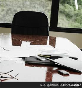 Documents with mobile phone on a table in an office