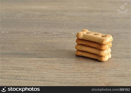 Dog biscuits isolated on a wooden background