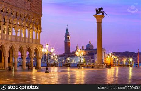 Doge Palace and Column of San Marco on Piazzeta San Marco at sunrise in Venice, Italy. San Giorgio di Maggiore on background.. San Marco square at sunrise. Venice, Italy