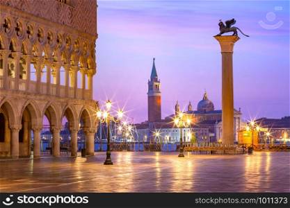 Doge Palace and Column of San Marco on Piazzeta San Marco at sunrise in Venice, Italy. San Giorgio di Maggiore on background.. San Marco square at sunrise. Venice, Italy