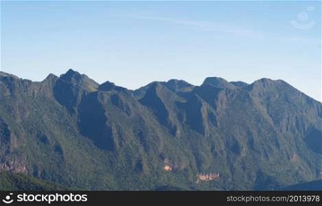 Doi Luang Chiang Dao peak, Chiang Mai, Thailand with forest trees and green mountain hills. Nature landscape background.