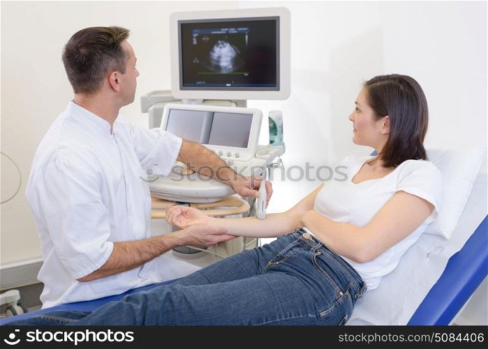 doing an ultrasound on the arm