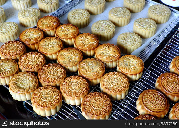 Doing moon cake for mid autumn festival at home, group of sweet cakes on tray, baking at home attractive many housewife that make food safety with delicious homemade product