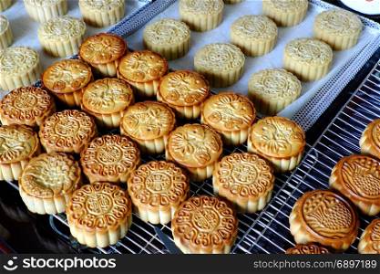 Doing moon cake for mid autumn festival at home, group of sweet cakes on tray, baking at home attractive many housewife that make food safety with delicious homemade product