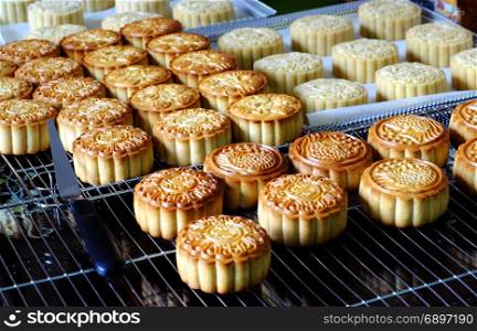 Doing moon cake for mid autumn festival at home, group of sweet cakes on tray, baking at home attractive many housewife that make food safety with delicious homemade product