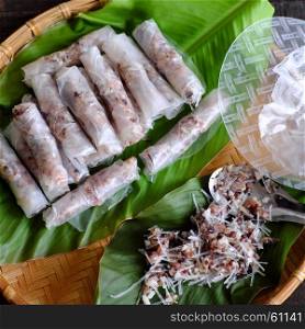 Doing Vietnamese egg roll or spring rolls or cha gio, is popular food at Vietnam cuisine, stuffing from meat and wrapper by rice paper